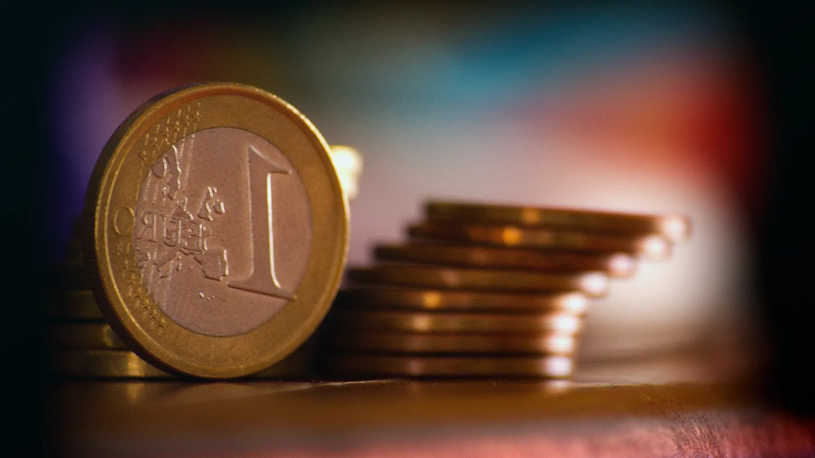 Minimum investment in euros — stacked euro coins